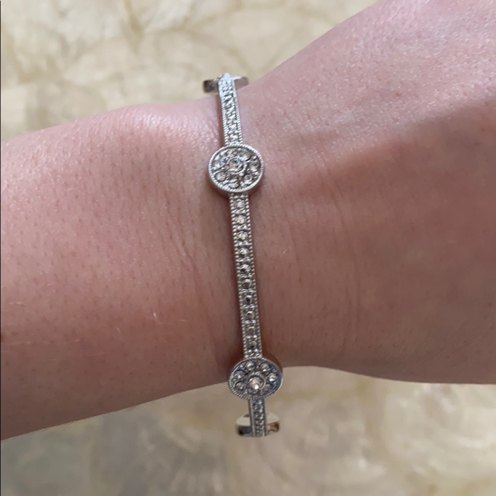 Elegant silver bangle with encrusted gems